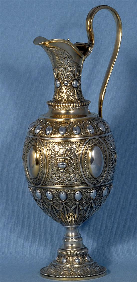 A mid Victorian parcel gilt silver ovoid shaped wine ewer/ claret jug, Height 13 ½”/340mm Weight 23.oz/653grms